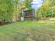 Sprawling backyard featuring lush greenery, mature trees, and a spacious lawn for outdoor activities and relaxation at 3900 Maplefield Dr, Raleigh, NC 27613