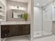 Modern bathroom featuring a sleek vanity, large mirror, and a glass-enclosed shower for a spa-like experience at 3900 Maplefield Dr, Raleigh, NC 27613