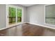 Bedroom featuring hardwood floors and a sliding glass door that leads to the balcony at 3900 Maplefield Dr, Raleigh, NC 27613