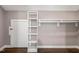 Spacious walk-in closet with ample shelving and a clothing rod for optimal organization and storage at 3900 Maplefield Dr, Raleigh, NC 27613