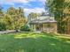 A picturesque home surrounded by lush greenery and a well-manicured lawn at 3900 Maplefield Dr, Raleigh, NC 27613