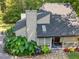 View of the home's exterior with a stone walkway, and lush greenery at 3900 Maplefield Dr, Raleigh, NC 27613