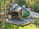 Charming home featuring a screened porch, spacious deck, and meticulously landscaped yard for outdoor enjoyment at 3900 Maplefield Dr, Raleigh, NC 27613