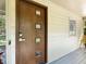 Unique modern front door with a secure smart lock at 3900 Maplefield Dr, Raleigh, NC 27613