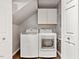 A well-lit laundry room featuring a modern washer and dryer at 3900 Maplefield Dr, Raleigh, NC 27613