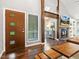 Open-concept living space with dark hardwood floors and a fireplace at 3900 Maplefield Dr, Raleigh, NC 27613