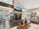 Cozy living room features a fireplace, built-in shelving, and a mounted television at 3900 Maplefield Dr, Raleigh, NC 27613