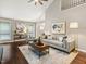 Bright living room featuring vaulted ceilings, modern furnishings, and stylish decor at 3900 Maplefield Dr, Raleigh, NC 27613