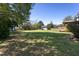 Expansive, well-maintained back yard with mature trees and a deck/gazebo at 3905 Autumn Creek Dr, Fuquay Varina, NC 27526