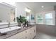 A luxurious bathroom with granite countertops and vessel sinks at 3905 Autumn Creek Dr, Fuquay Varina, NC 27526
