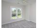 Bedroom featuring ample natural light and backyard views at 3905 Autumn Creek Dr, Fuquay Varina, NC 27526