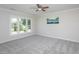 Bedroom with neutral paint, plush carpet, and large window at 3905 Autumn Creek Dr, Fuquay Varina, NC 27526