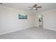 Neutral bedroom with a ceiling fan and an ensuite bathroom view at 3905 Autumn Creek Dr, Fuquay Varina, NC 27526