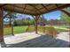 Wooden gazebo featuring a wooden plank floor and backyard views at 3905 Autumn Creek Dr, Fuquay Varina, NC 27526