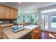 Bright kitchen featuring wood cabinets, sink, and ample counter space at 3905 Autumn Creek Dr, Fuquay Varina, NC 27526