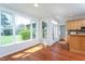 Light filled breakfast nook with wood floors and large bay windows at 3905 Autumn Creek Dr, Fuquay Varina, NC 27526