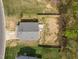 An aerial view of the home displaying the yard, back deck, and home's layout at 420 Feldspar Way, Durham, NC 27703