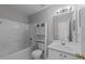 Bathroom featuring a shower-tub combo and a white vanity with storage at 420 Feldspar Way, Durham, NC 27703