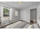 Bedroom features a large window, closet, and neutral walls at 420 Feldspar Way, Durham, NC 27703