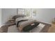 Bright bedroom featuring a platform bed, stylish rug, and ample natural light from the double windows at 420 Feldspar Way, Durham, NC 27703