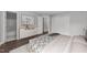 Bedroom features a bed with patterned linens, dresser, and access to an ensuite bath at 420 Feldspar Way, Durham, NC 27703