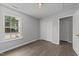 Bedroom featuring a large window, closet, and modern door hardware at 420 Feldspar Way, Durham, NC 27703