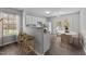 Eat-in kitchen offers white cabinets, stainless steel appliances, and bar seating at 420 Feldspar Way, Durham, NC 27703