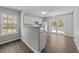 Bright, open kitchen with white cabinetry, granite countertops, and sliding glass doors at 420 Feldspar Way, Durham, NC 27703