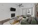 Bright living room features a marble fireplace, ceiling fan, and modern furnishings at 420 Feldspar Way, Durham, NC 27703