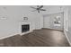 Clean living room featuring a marble fireplace and new flooring at 420 Feldspar Way, Durham, NC 27703