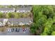 A high angle view of townhomes with ample parking and green spaces at 4523 Tarkiln Pl, Wake Forest, NC 27587