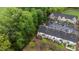 An aerial view of townhomes surrounded by lush greenery and a parking lot at 4523 Tarkiln Pl, Wake Forest, NC 27587