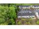 A bird's eye view of townhouses with parking, landscaping and lush greenery at 4523 Tarkiln Pl, Wake Forest, NC 27587