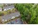 Aerial view of townhomes showcasing parking and community green spaces at 4523 Tarkiln Pl, Wake Forest, NC 27587