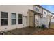 A cozy back patio with sliding door access and adjacent vinyl siding at 4523 Tarkiln Pl, Wake Forest, NC 27587