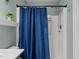 A bathroom featuring a standing shower with a blue shower curtain at 4523 Tarkiln Pl, Wake Forest, NC 27587