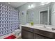 This is a well-lit bathroom with a shower-tub combo and a vanity with storage, perfect for everyday use at 4523 Tarkiln Pl, Wake Forest, NC 27587