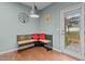 A breakfast nook featuring a bench seat with red pillows and a door leading to the outside at 4523 Tarkiln Pl, Wake Forest, NC 27587