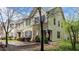Charming two-story townhome with stone accents and well-maintained landscaping at 4523 Tarkiln Pl, Wake Forest, NC 27587