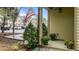 Cozy covered front porch, adorned with colorful potted plants at 4523 Tarkiln Pl, Wake Forest, NC 27587