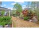 Beautifully landscaped backyard featuring a patio area, lush gardens, and mature trees at 463 Old Piedmont Cir, Chapel Hill, NC 27516