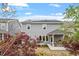 Exterior view of the home with solar panels, covered patio, and beautifully landscaped yard at 463 Old Piedmont Cir, Chapel Hill, NC 27516