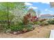 Picturesque backyard with garden, mature trees and landscaping at 463 Old Piedmont Cir, Chapel Hill, NC 27516