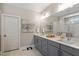 This modern bathroom features double sinks, quartz countertops, and a large vanity at 463 Old Piedmont Cir, Chapel Hill, NC 27516