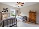 This comfortable bedroom features two twin beds, natural light, and ceiling fan at 463 Old Piedmont Cir, Chapel Hill, NC 27516