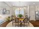 Charming dining area with a round table, seating for eight, and stylish light fixture at 463 Old Piedmont Cir, Chapel Hill, NC 27516