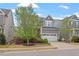 Well-maintained home with a two-car garage, beautiful landscaping, and a welcoming front yard at 463 Old Piedmont Cir, Chapel Hill, NC 27516