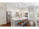 Bright kitchen features a large island, stainless steel appliances, and ample white cabinetry at 463 Old Piedmont Cir, Chapel Hill, NC 27516