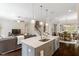 Island with sink and seating separates the kitchen and dining area at 463 Old Piedmont Cir, Chapel Hill, NC 27516