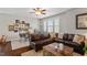This spacious living room features a comfortable sectional and dining area with a ceiling fan at 463 Old Piedmont Cir, Chapel Hill, NC 27516